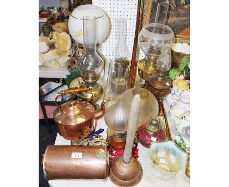 An early 20th century brass oil lamp; others a vaseline glass lamp;  others; a copper and brass foot warmer; a copper hunting