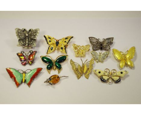 An enamel butterfly brooch;  others, various;  a silver and amber mouse brooch;  etc 