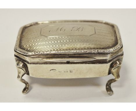 A George V silver canted rectangular dressing table trinket box, hinged engine-turned cover, cabriole legs, 7cm wide, Birming