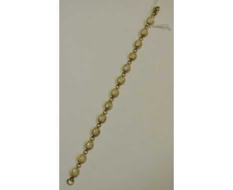 A 9ct gold bracelet each link set with an oval opal, 13 in total gross weight 9g