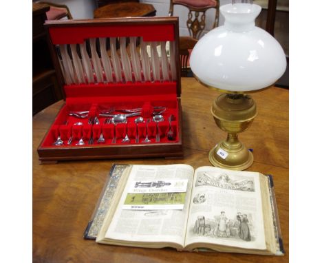 A brass oil lamp; a canteen of cutlery; The Girls own papers 1880; stamps