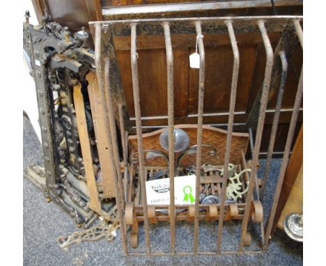 Two cast iron table bases; a cast iron fire grate; a hay rack; cast iron hinges; Pricket candlestick (4th prize in Great York