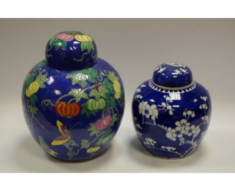 A 19th century Chinese ovoid ginger jar and cover, painted overall in tones of underglaze blue with blossoming prunus on a gr