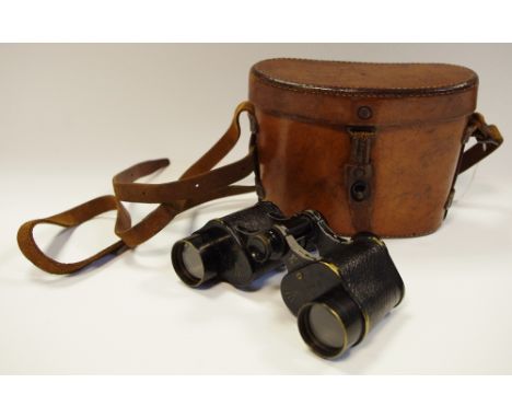 A cased pair of WWI Bausch & Lomb 6x30 Military Stereo Binoculars, original leather carrying case, each baring broad arrow st