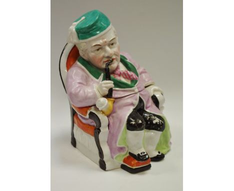 A 19th century novelty tobacco jar seated pipe smoker, incised marks, c.1890