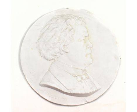 L STEINMAN; a plaster roundel depicting the profile portrait bust of a gentleman, signed and dated 1885, diameter 35cm.