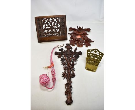 A Victorian cranberry glass pipe with milk glass trailed decoration, height 50cm, a Black Forest photo frame carved with a st