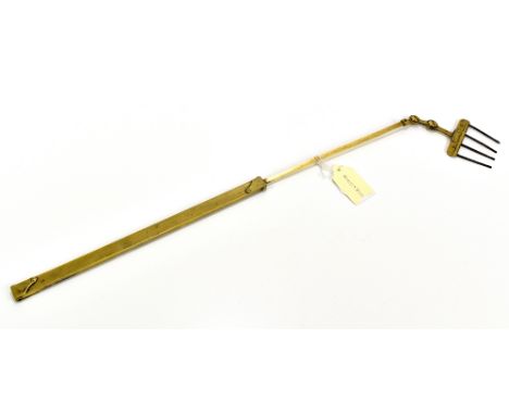 A 19th century brass extendable toasting fork, with swivel top, overall length 67cm.Additional InformationGeneral wear, minor