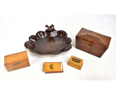 A 19th century mahogany twin division sarcophagus tea caddy, 11.5 x 19.5cm, a money box, a Mauchline ware 'Colwyn Bay' box, p