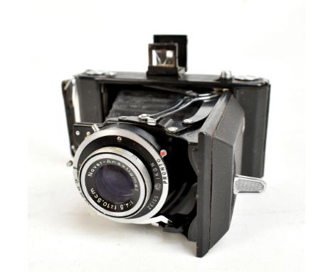 ZEISS; an Ikon bellows camera with Novar-Anastigmat 1:4.5 F=10.5CM lens, in leather case.Additional InformationNot tested, no