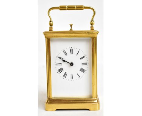 A late 19th century French brass cased repeating carriage clock, the enamel dial set with Roman numerals, with twin drum move