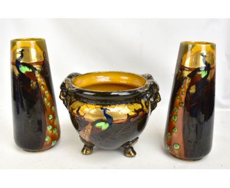 PHOENIX WARE; a Peacock pattern planter with twin satyr masks on three feet, 25 x 33cm, and matching pair of tapered vases, h