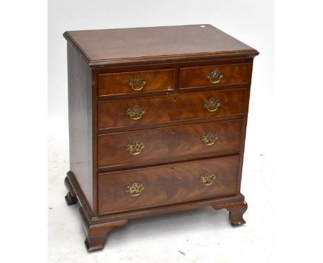A reproduction mahogany chest of small proportions with two short over three long drawers, raised on bracket feet, height 82c