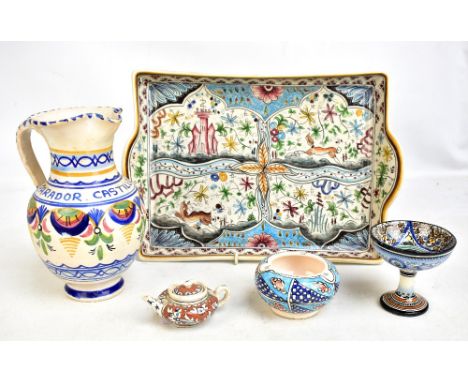 A group of Italian and Portuguese faience ware comprising twin handled tray, 37 x 26.5cm, pedestal bowl with putto to centre 