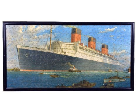 CHAD VALLEY; a jigsaw puzzle depicting HMS Queen Mary, 35.5 x 68cm, inset within frame.Additional InformationFrame measures 3