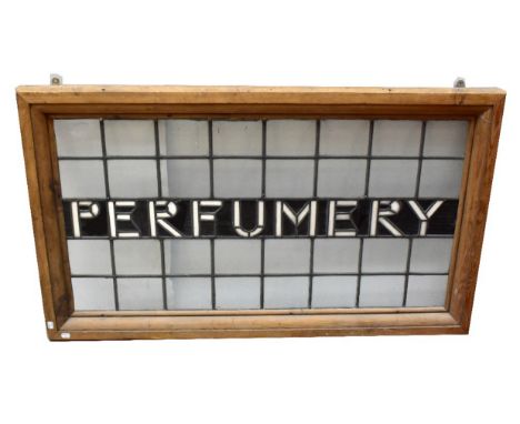 A 20th century leaded stained glass advertising panel 'Perfumery' set in pine frame, 60 x 113cm.Additional InformationFrame m