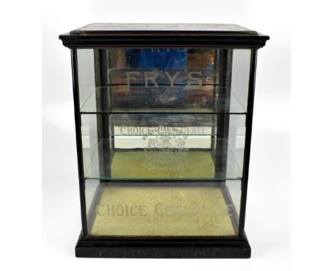 J.S FRY &amp; SONS LIMITED; an original advertising chocolate cabinet with single etched panel, raised on carved advertising 