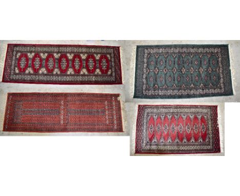 Four Middle Eastern hand knotted rugs, three red and one green ground, the largest 155 x 89cm (4).Additional InformationLight