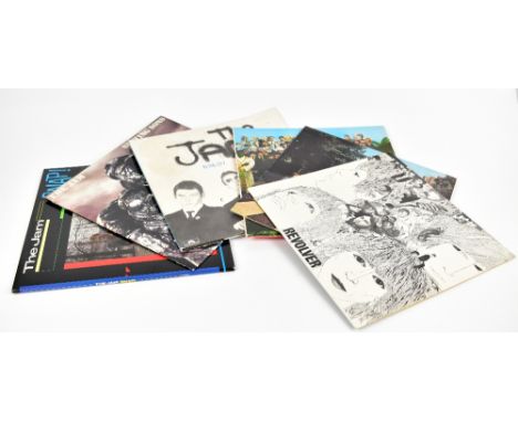 A collection of vinyl records and singles including The Jam, The Beatles, John Lenon, Elton John.Additional InformationPlease