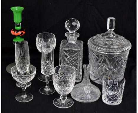 A group of clear cut and moulded glass tableware including ice pail, five decanters including ship type example, champagne sa