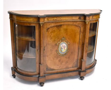 A Victorian burr walnut and inlaid credenza with gilt metal mounts and painted porcelain plaque to central door enclosing sin