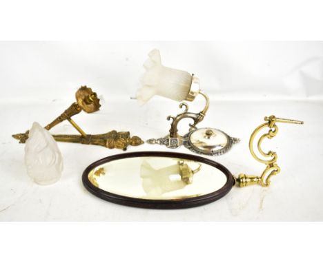 A decorative single bracket cast metal wall light with flaming torch shade, a silver metalled wall light with frosted glass s