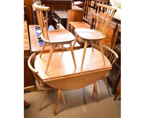 ERCOL; an elm drop leaf table on splayed supports, approx 72 x 112 x 120cm when extended, and a set of four cross spindelled 