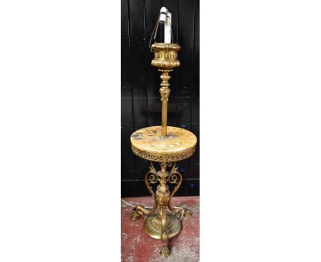 A late 19th century gilt metal standard lamp with circular marble plinth, raised above urn shaped column supports terminating