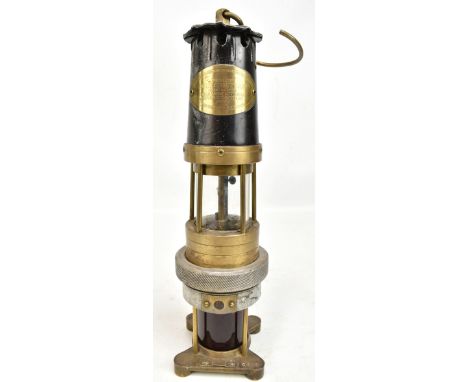 NAYLOR OF WIGAN; an early 20th century 'Spiralarm' miner's safety lamp with aluminium bonnet, applied manufacturer's plaque a