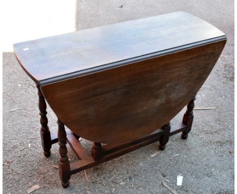 An oak drop leaf gate leg dining table, height 75cm, length 96cm, and a pair of Windsor kitchen chairs (3).Additional Informa