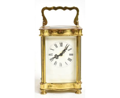 A late 19th century brass cased carriage clock, the dial with Roman numerals, height including swing handle 15.5cm.Additional