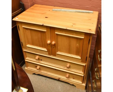 A modern pine cabinet with two panelled doors above two base draws raised on bracket feet, height 93cm, width&nbsp; 92cm, dep