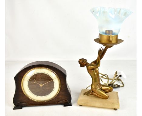 An Art Deco bronzed figural table lamp with associated Vaseline glass shade, on stepped rectangular hardstone base to brass f