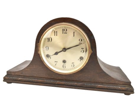 An early 20th century oak case eight day mantel clock, the circular silver dial set with Arabic numerals, 23 x 43cm.Additiona