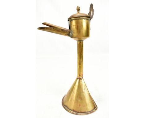 A 19th century brass rush light/lamp, height 27.5cm.Additional InformationSome dents, pitting, tarnish, dirt etc.