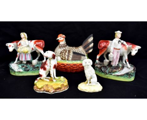 A collection of 19th century and later Staffordshire to include a pair of flat back figures depicting a male and female milki