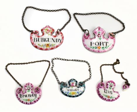 Three early 20th century enamelled decanter labels to include Burgundy, Port and two further decanter labels (part af) (5).Ad
