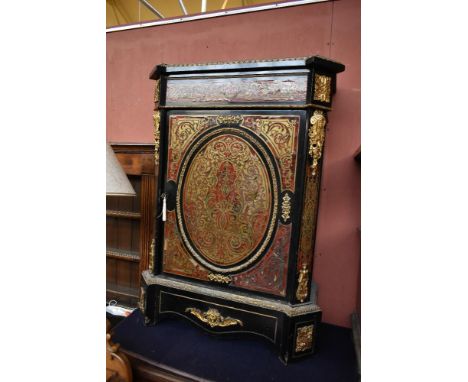 A 19th century French Boulle work pier cabinet, with single panelled door, raised on shaped bracket support, height 112cm, wi