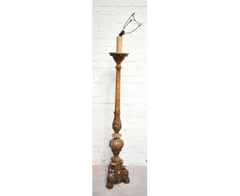 A mid-20th century carved walnut standard lamp raised on paw feet, height 163cm.Additional InformationMinor chipping to the b