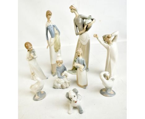 LLADRO; six figures and three further similar, including one Nao (9).Additional InformationShepherd boy with loose piece to i