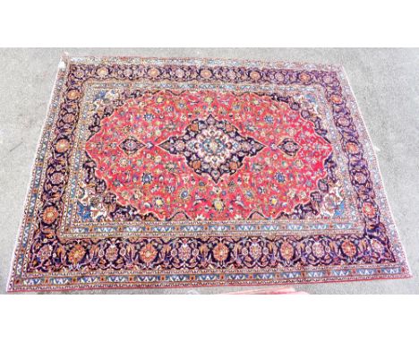 A good quality Eastern style rug with stylised symbols and floral decoration, 335 x 258cm.Additional InformationColours are g