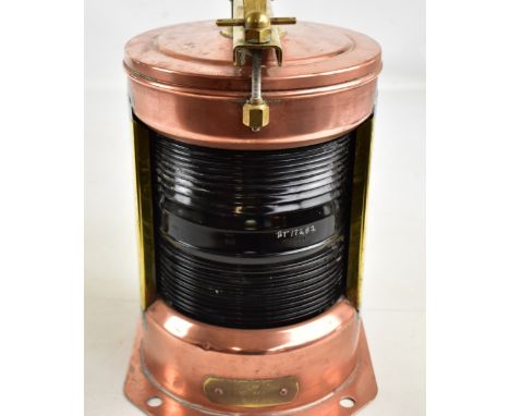 An early 20th century copper and brass naval 'Stern' lamp with screw down top carrying bar inscribed 'IP56' with ribbed glass