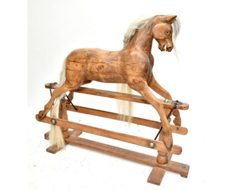 LINES BROTHERS LTD; an early/mid-20th century 'Sportiboy' model rocking horse with glass eyes and white mane, on pine trestle