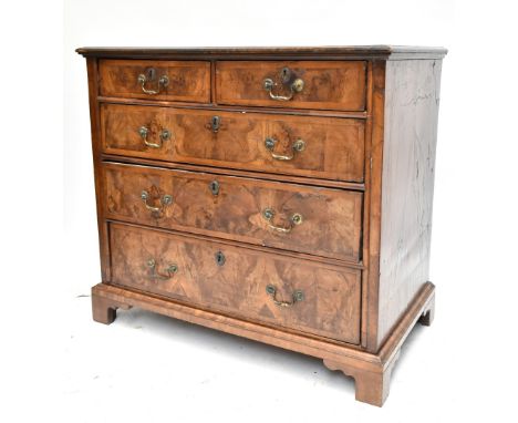 A George III walnut straight front chest of two short over three long drawers, raised on bracket feet, height 86cm, length 94