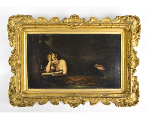 A mid 19th century oil on canvas laid on board, depicting a semi-nude maiden reading beside oil lamp, appears unsigned, frame
