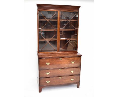 A 19th century mahogany bookcase with twin astragal glazed doors enclosing three shelves on associated three drawer chest bas