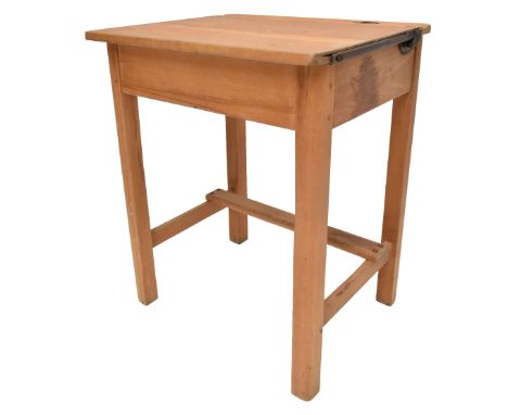 A pine school desk with hinged lid and recess for inkwell, 68 x 56 x 46cm.Additional InformationScuffs, scrapes and abrasions