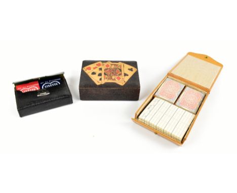 ASPREY OF LONDON; a leather cased canasta game set, together with a pen and poker work card holder, decorated with playing ca