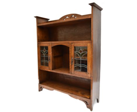 An Arts &amp; Crafts medium oak freestanding bookcase with two leaded glazed doors above single shelf, height 137.5cm, length