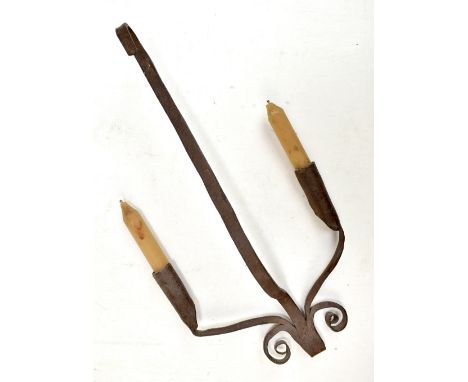 A 19th century wrought iron twin sconce hanging candle stick, 38 x 19cm.Additional InformationSurface corrosion, denting and 